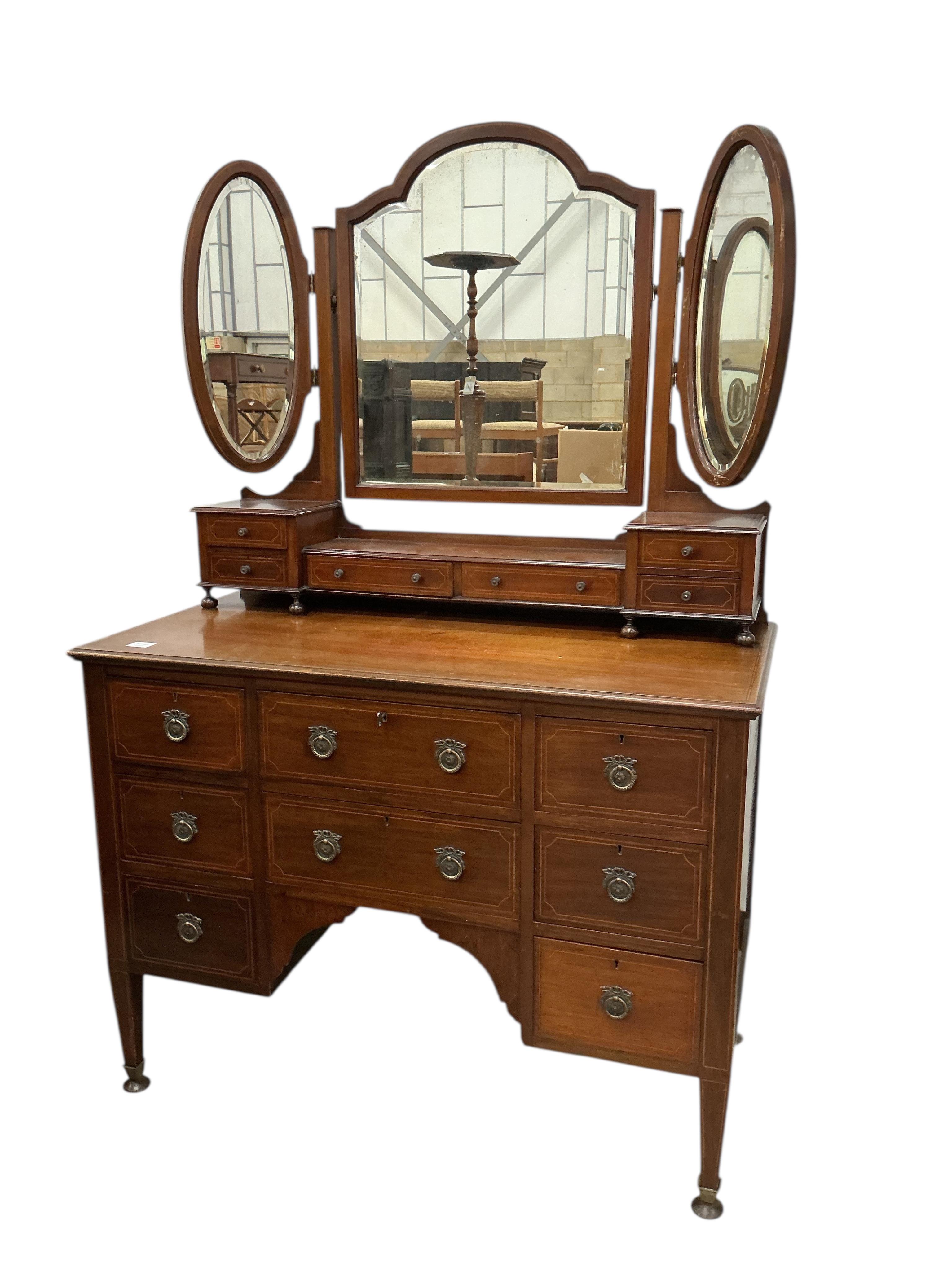 An Edwardian inlaid mahogany dressing table and matching chest of four drawers, larger width 124cm, depth 56cm, height 175cm